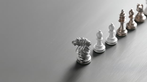Minimalist conceptual image of chess pieces on sleek gray surface photo
