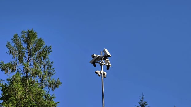Surveillance Cameras Positioned on Tower for an Impressive and Comprehensive Sky View photo