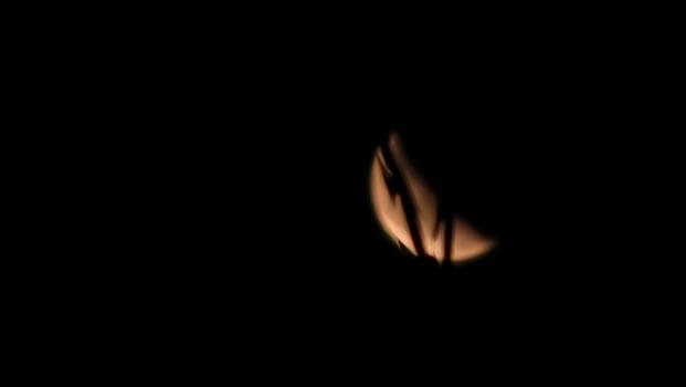 A close up of a black object in the dark photo