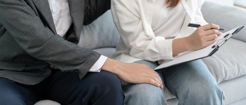 senior sexually harassed a female colleague by touch her leg. Sexual harassment in office. feel anxious and stressed from being harassed. molest, assault, inappropriate,. photo