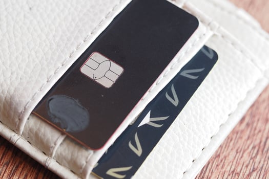 Credit card and SIM card in a wallet on wooden table photo