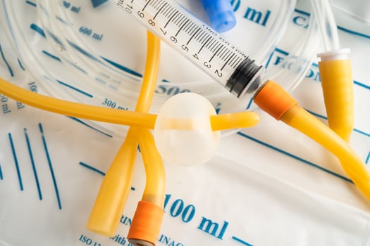 Foley urinary catheter with urine bag disability photo
