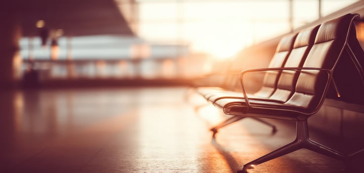 Empty airport terminal seating with warm sunlight creating mindful atmosphere for solo travelers waiting for their flight at boarding gate during peaceful travel trip departure journey photo