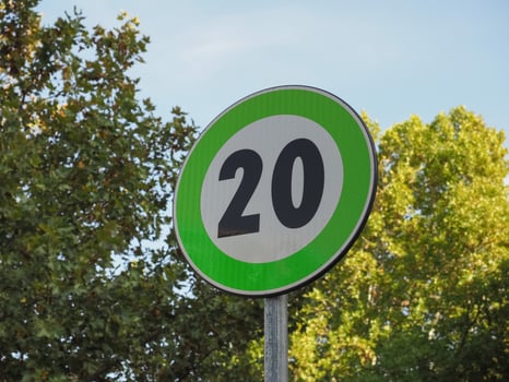 new green advisory speed limit sign photo