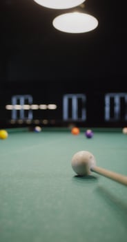A billiard stick on a pool table photo