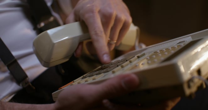 A man holding a phone photo