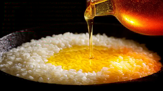 Golden Honey Pouring onto White Rice in a Dark Bowl. photo