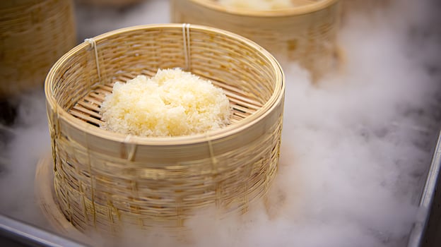 Steaming Bamboo Baskets Filled With Fluffy White Rice. photo