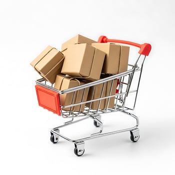 A miniature shopping cart filled with small cardboard boxes on a plain white background studio shot photo