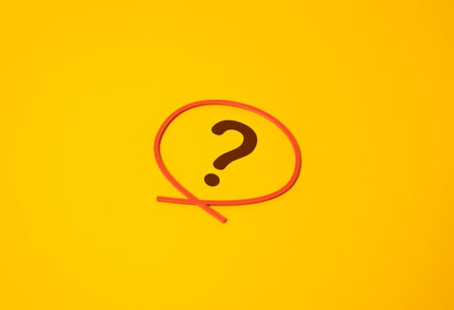 The question mark is outlined in a red circle. Focus on a question or uncertainty. Pending issues in business, politics, or personal finance. Unresolved problems, doubt. photo