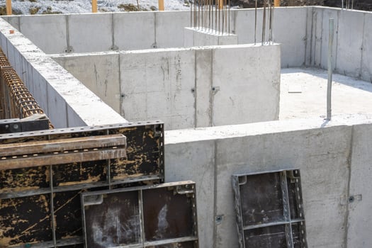 Construction Site With New Concrete Foundation Being Prepared in Residential Area photo