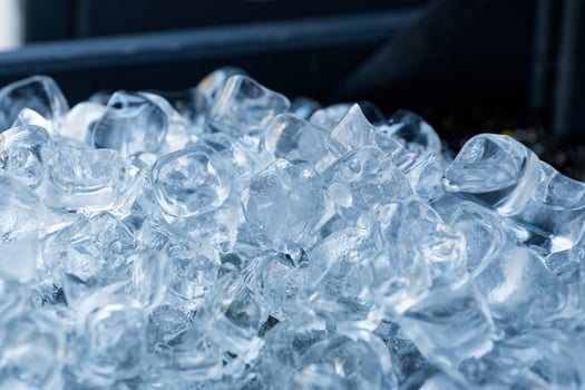 Ice cubes from a restaurant melt in the summer heat photo