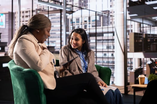 Diverse team of empowered women bosses strategizing a project to increase budget in a high end office. Leadership, ambition, and gender equality drive their business success in a work environment. photo