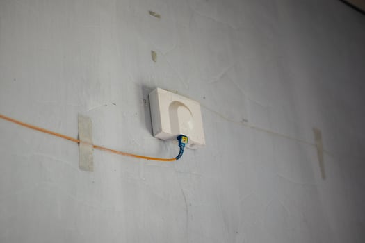 Ethernet Cable Plugged Into Wall Socket photo