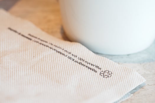 Napkin with eco-friendly message at a local cafe photo
