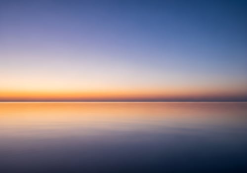 Calm Ocean Horizon at Twilight with Gradient Sky photo