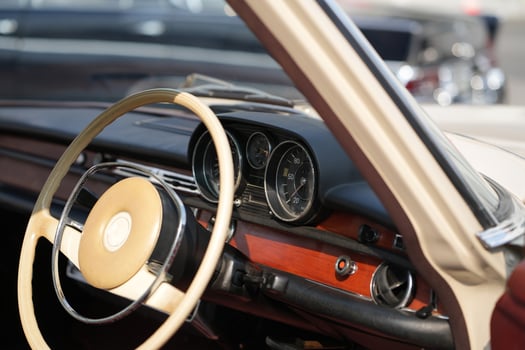 Vintage Classic car steering wheel, with chrome and leather textures in sharp detail, showcases the quality and precision of automotive craftsmanship under natural light.bb photo