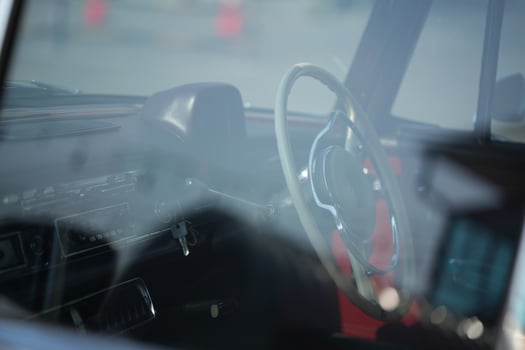 Vintage Classic car steering wheel, with chrome and leather textures in sharp detail, showcases the quality and precision of automotive craftsmanship under natural light.aa photo