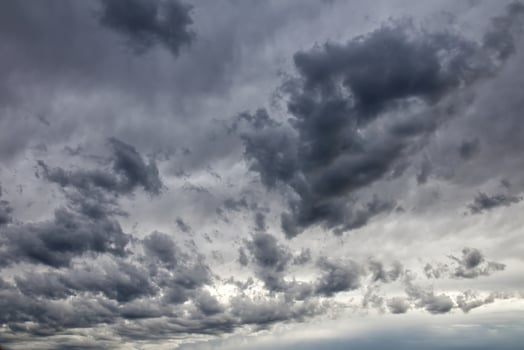 Dramatic dark and ominous storm clouds filling the sky on an overcast day. photo