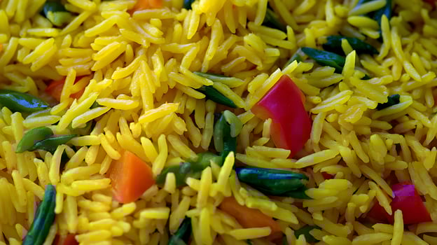 Close Up Macro Shot of Flavorful Rice Pilaf with Colorful Vegetables. photo