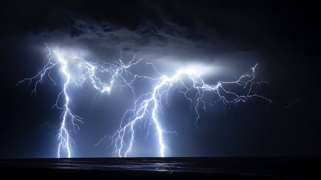 Powerful lightning strikes illuminate a dark and stormy night sky. photo