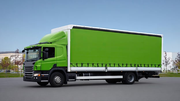 A green truck with a white trailer photo