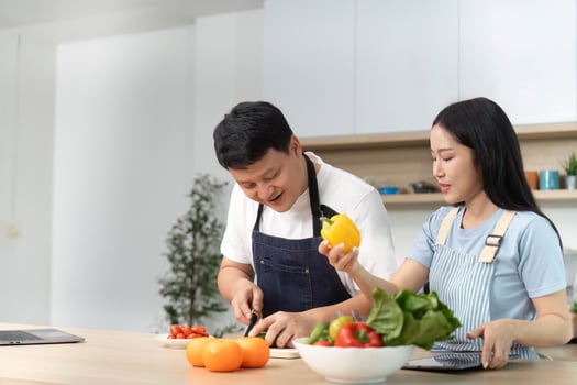 Healthy Meal Prep. Couple Enjoying Cooking Together in Bright Kitchen photo