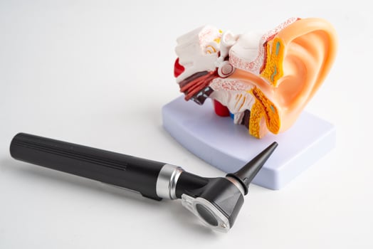 Otoscope isolated on white background for otolaryngologist or ENT physician doctor examining senior patient ear, hearing loss photo
