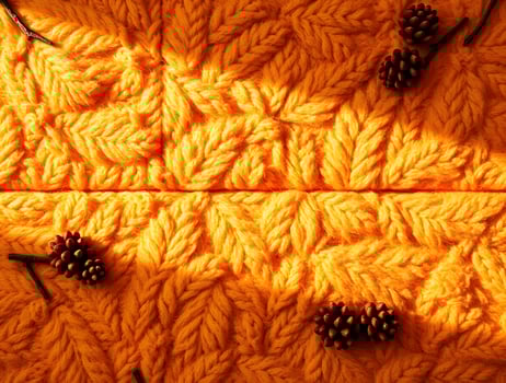 Vibrant Autumn Knit Texture Golden Yarn and Pine Cones photo