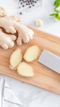 Fresh Ginger Slices, Garlic Clove, and Black Peppercorns on a Wooden Cutting Board, Ready for Culinary Creation. Healthy Cooking Ingredients. photo