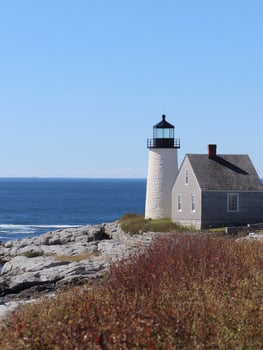 Lighthouse and Building at Coastal Location photo