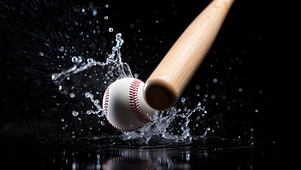 Baseball bat hitting a baseball creating a dramatic water splash explosion photo