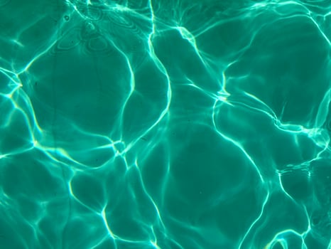 Detailed aqua water texture with natural moving light reflections suitable for digital backgrounds user interfaces meditation visuals and calming wallpapers focused on flow softness and clarity photo
