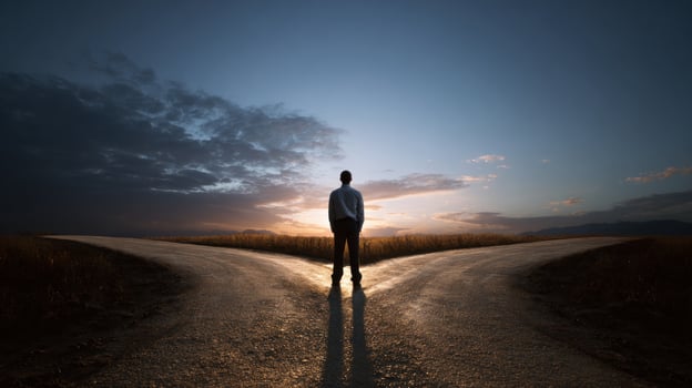 Man at crossroads, sunset photo