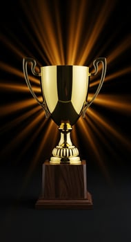 Gleaming Gold Trophy on Wooden Base with Dramatic Light Burst Background. photo