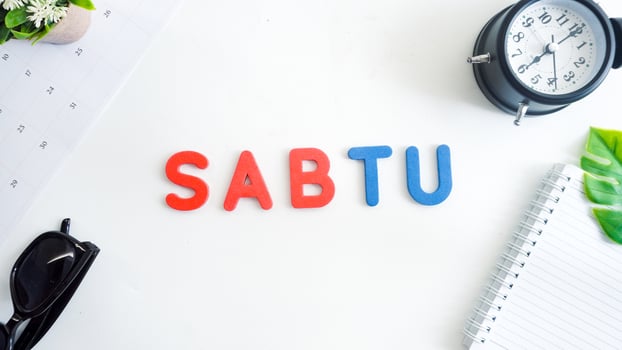 Flat lay composition with blue and red color foam letters spelling word saturday in Indonesian, SABTU isolated on white background photo