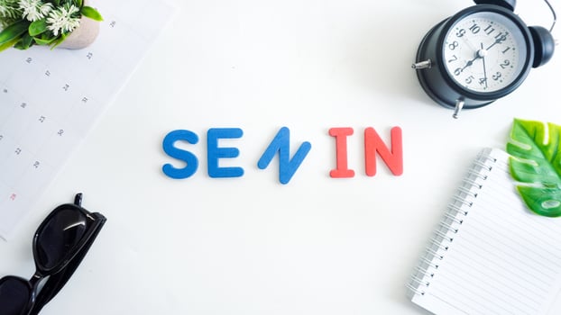 Flat lay composition with red and blue color foam letters spelling word monday in Indonesian, SENIN isolated on white background photo
