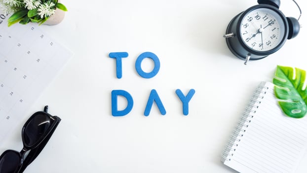 Flat lay composition with blue color foam letters spelling word TODAY isolated on white background photo