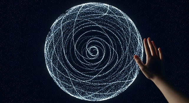 A hand reaching out to touch a circular object photo
