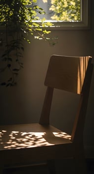A chair sitting in front of a window photo