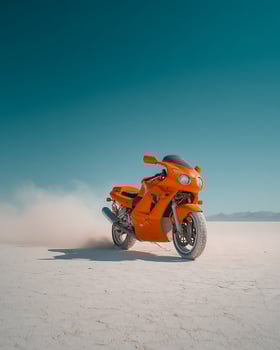 Orange Sports Motorcycle Racing Across Flat White Salt Desert With Dust Kicking Behind, Captured in Isolated Frame With Clear Blue Sky photo