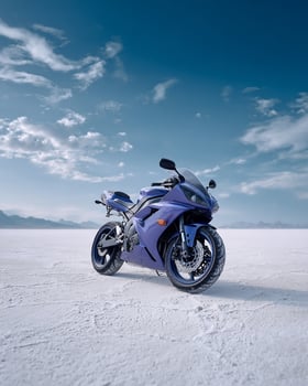 Bold Purple Motorbike Zooming Over Bright White Salt Desert With Dust Clouds and Vivid Blue Sky in Minimal Aesthetic photo
