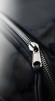 Close up of zipper on black fabric photo