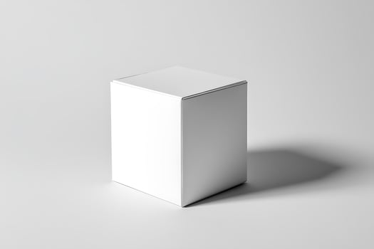 White Cube Box on Light Gray Surface with Shadow in Minimalist Studio photo