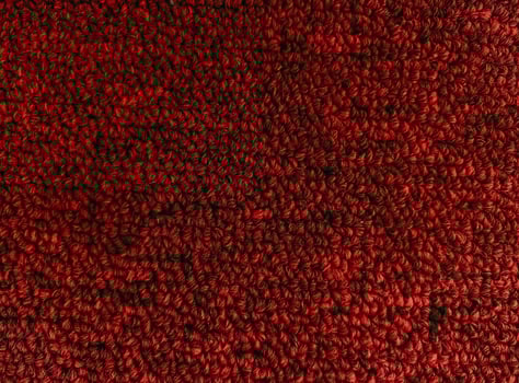 Texture of a knitted red sweater wallpaper. photo