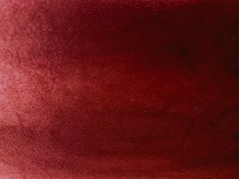 Red velvet fabric texture used as background. photo