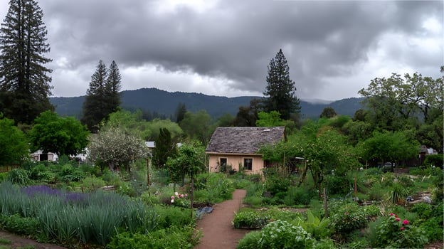 Idyllic Countryside Garden Retreat with Mountain Backdrop and Cozy Cabin. photo