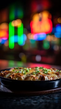 Sizzling Hot Enchiladas Covered in Cheese and Green Onions in Dim Light. photo
