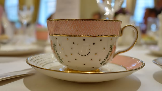 A Cheerful Tea Cup With a Happy Face Ready for a Delightful Afternoon. photo