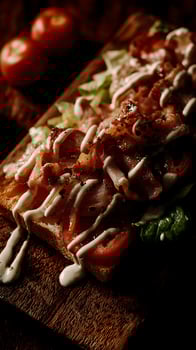 Delicious BLT Sandwich Ready to Eat on a Wooden Board. photo